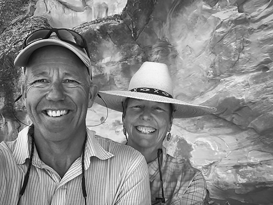 Phil and Mary DeRiemer smiling. Black and White image.
